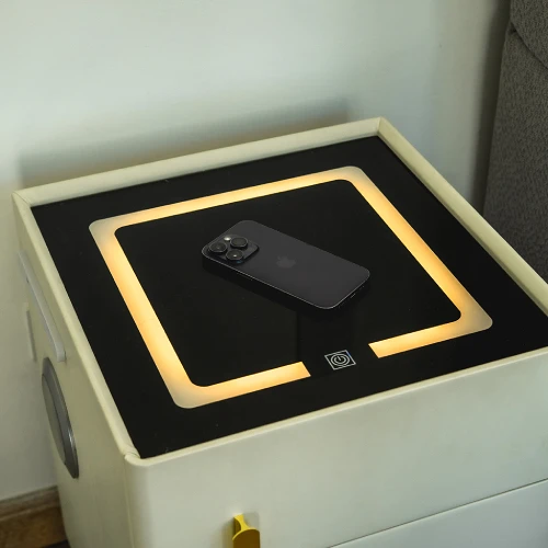 Tech-ready furniture on each side of the bed that allows you to charge your devices wirelessly while you rest.