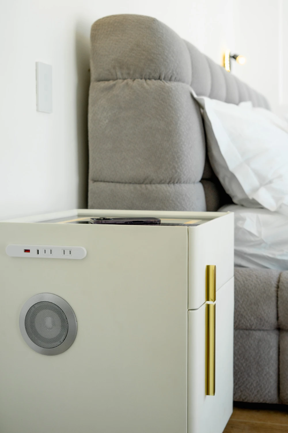 Smart nightstand with wireless charging, USB ports, and a built-in speaker.