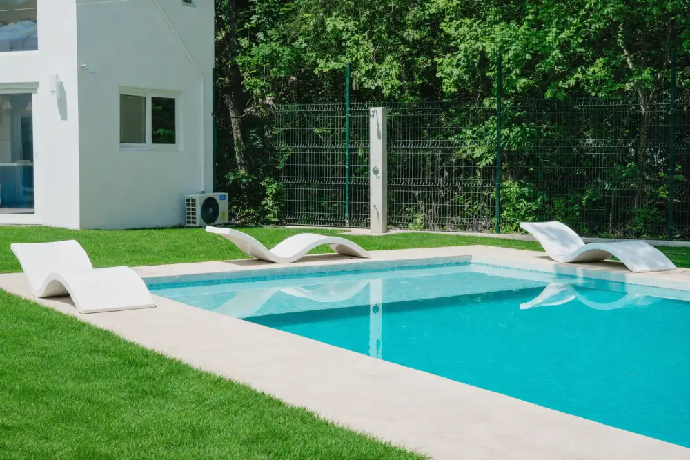 The pool features ergonomically designed lounge chairs around it for guest comfort.