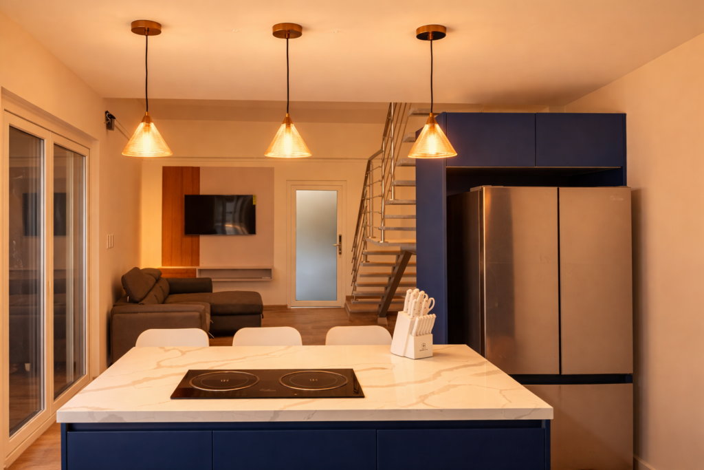 View of the living area and integrated kitchen offering a cozy and modern atmosphere with high-end finishes and open spaces